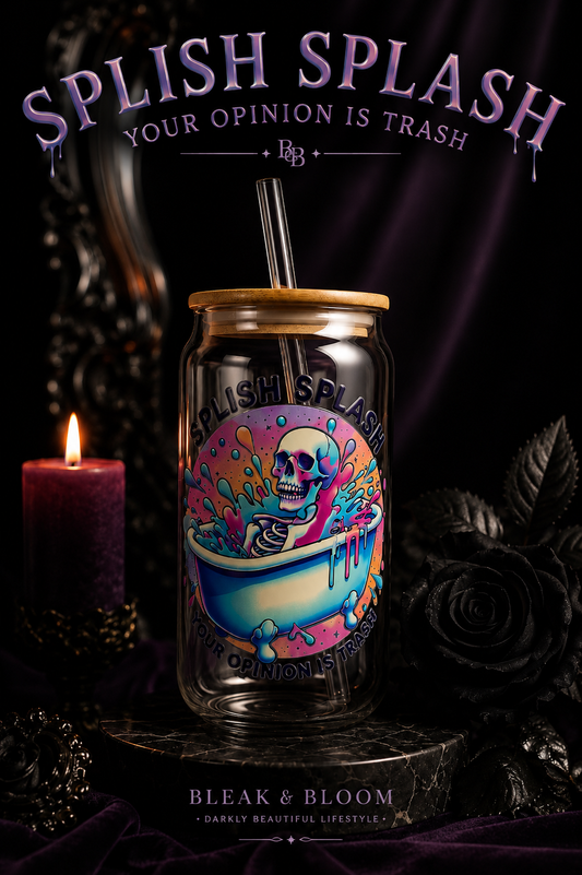 Decorative glass tumbler with colorful design and text 'Splish Splash Your Opinion is Trash' on a dark background.